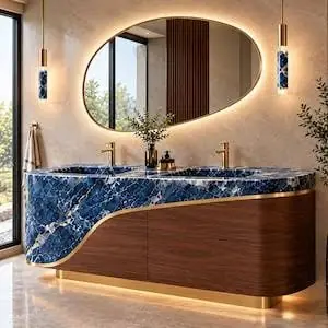 Curved vanity with a deep blue stone top and lit oval mirror